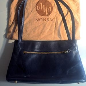 Black monsac purse in amazing condition. No flaws or blemishes at all. Key ring